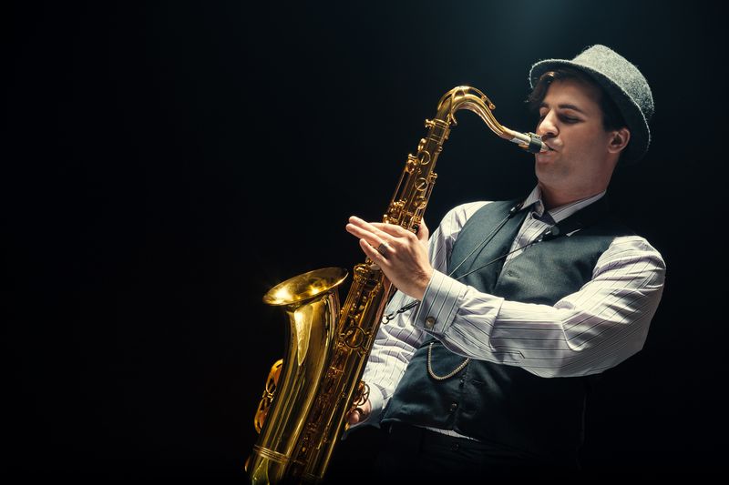 Young Man Playing The Saxophone